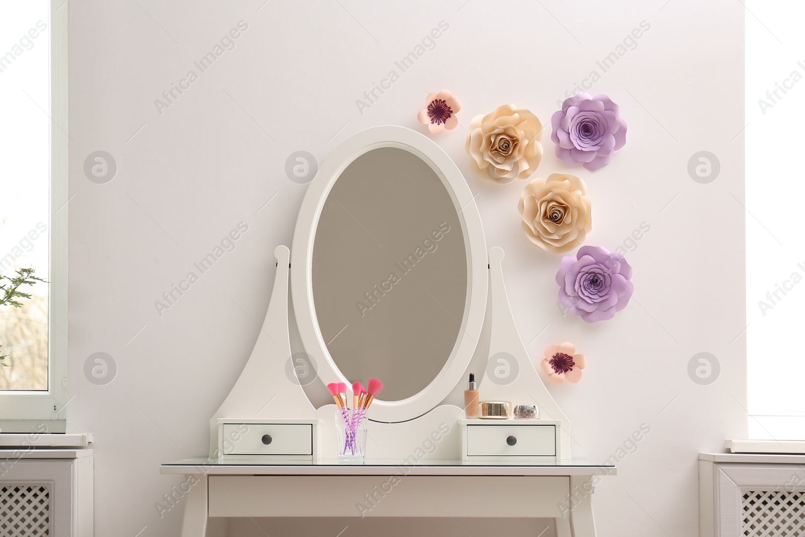 Photo of Stylish room interior with floral decor and dressing table