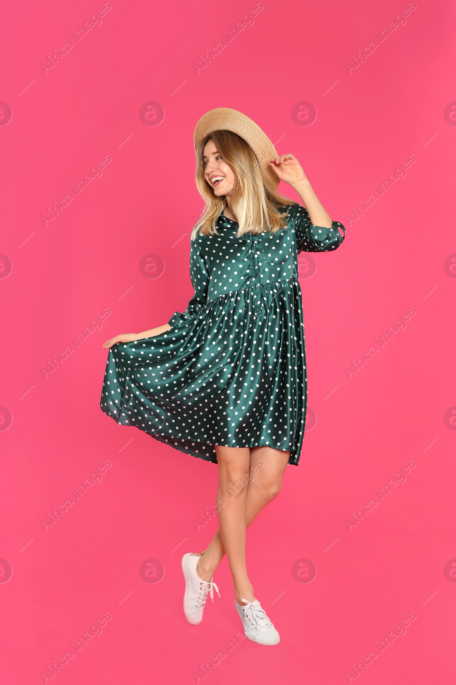 Photo of Full length portrait of emotional woman on color background