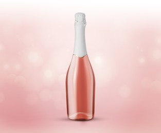 Image of Bottle of expensive sparkling rose wine on pink background