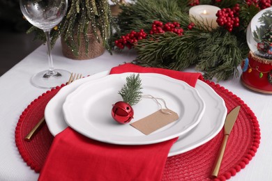 Luxury place setting with beautiful festive decor for Christmas dinner on white table, closeup