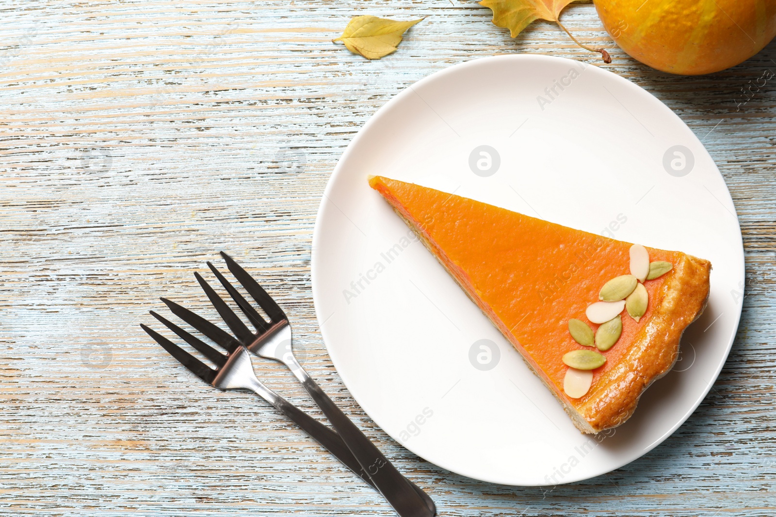 Photo of Flat lay composition with fresh delicious homemade pumpkin pie on wooden background