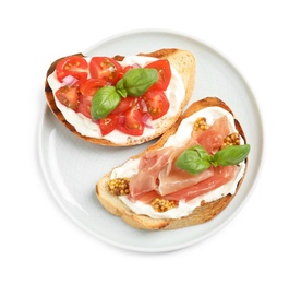 Plate with tasty bruschettas on white background, top view