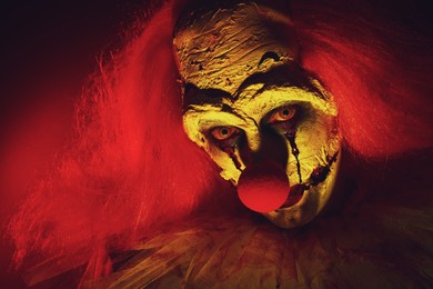 Photo of Portraitterrifying clown, closeup. Halloween party costume
