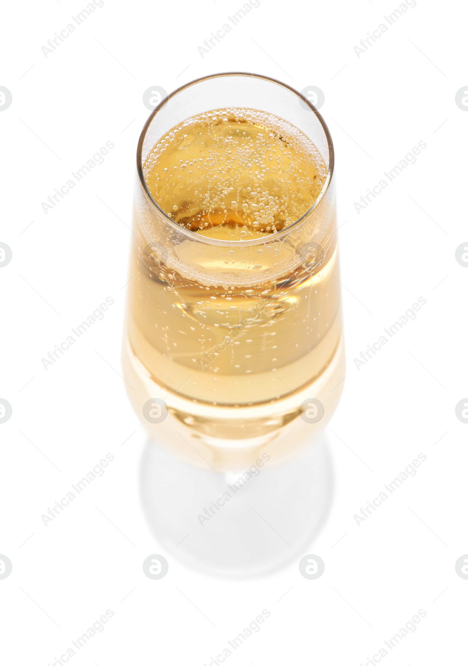 Photo of Glass of champagne on white background. Festive drink