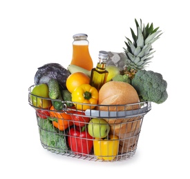 Photo of Shopping basket with grocery products on white background