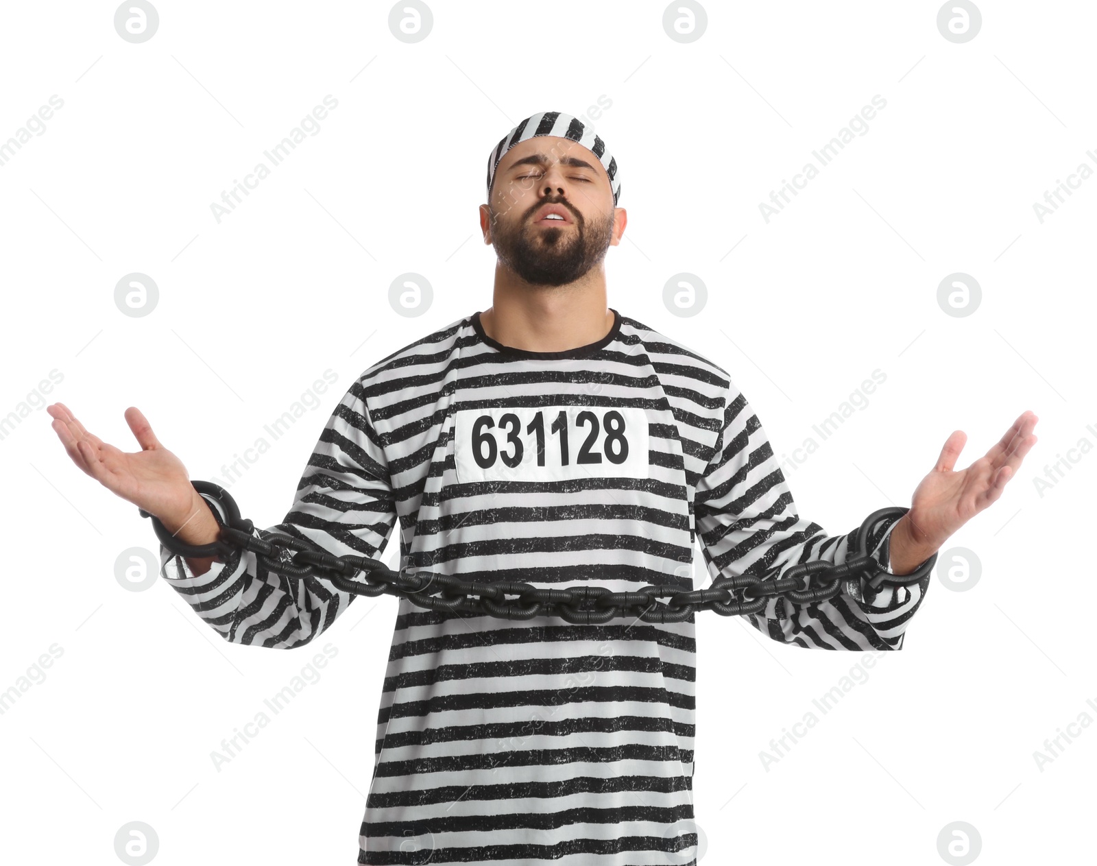 Photo of Prisoner in special uniform with chained hands on white background