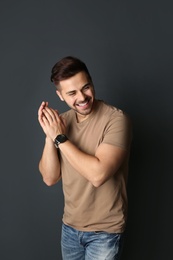 Photo of Portrait of handsome man on dark background