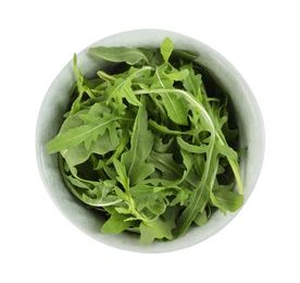 Delicious fresh arugula in bowl isolated on white, top view