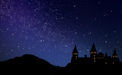 Image of Fairy tale world. Magnificent castle under starry sky at night