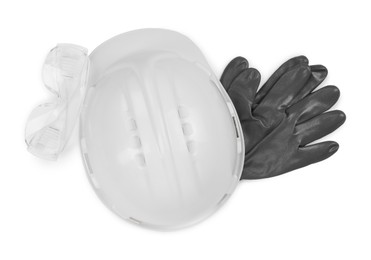 Hard hat, goggles and gloves isolated on white, top view. Safety equipment