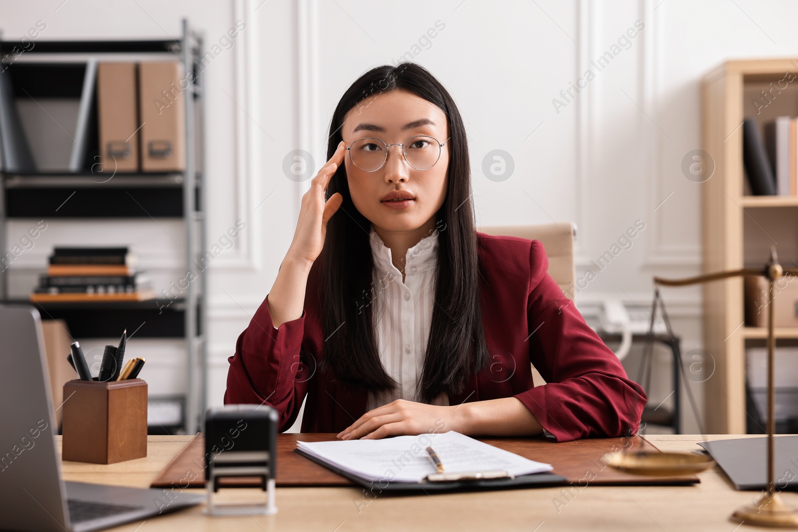 Photo of Portrait of notary at table in office