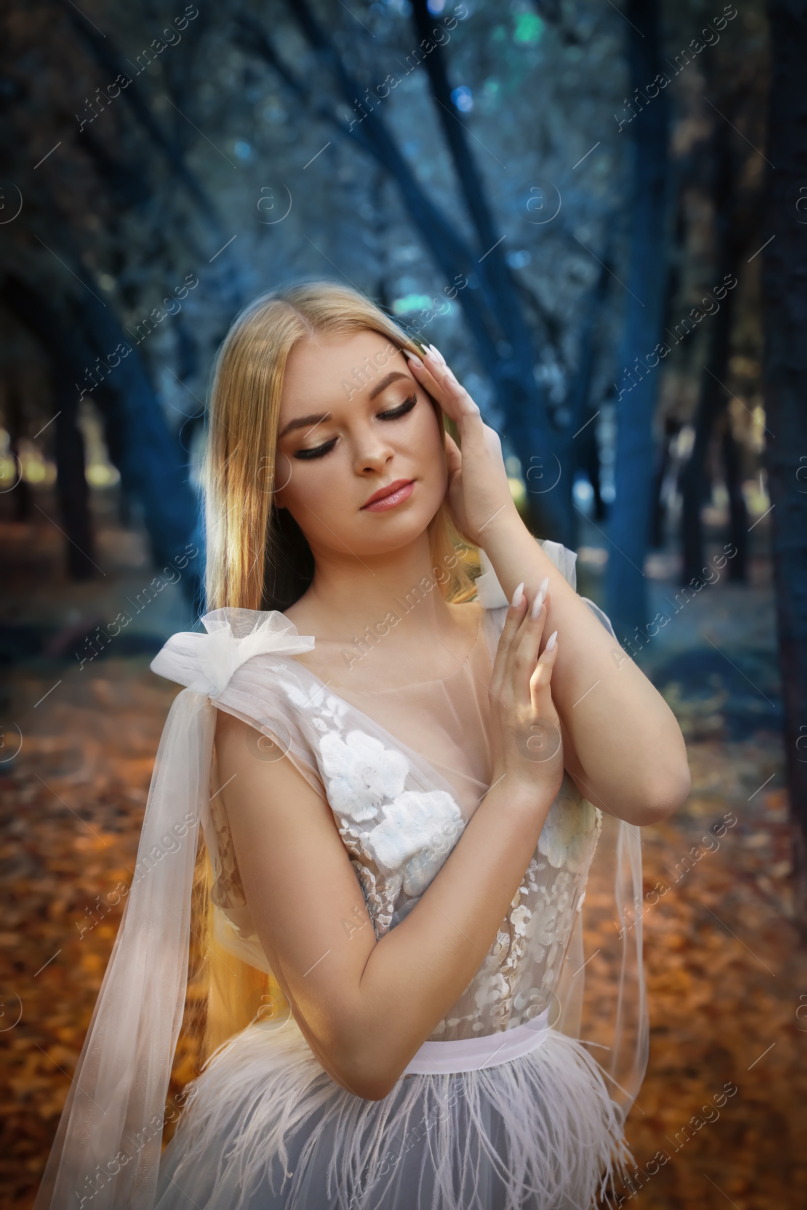 Photo of Beautiful girl wearing fairy dress in autumn forest