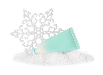 Photo of Tube of hand cream and Christmas decor isolated on white. Winter skin care