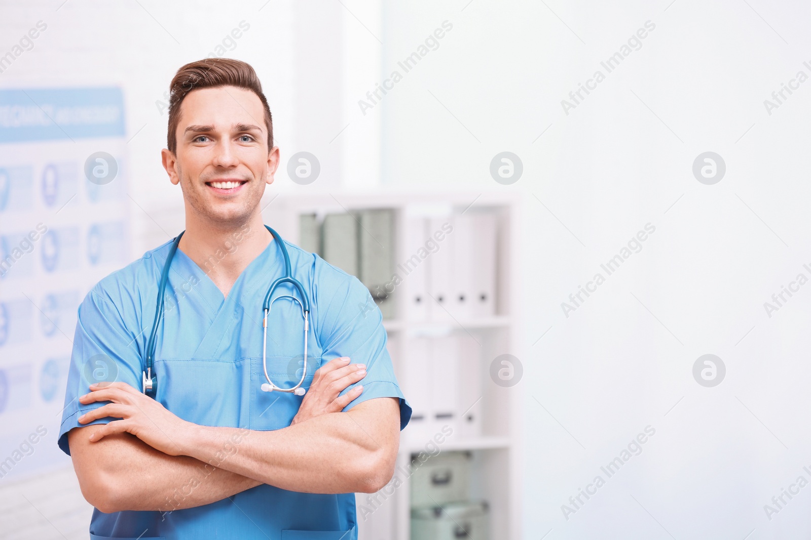 Photo of Portrait of medical assistant with stethoscope in hospital. Space for text