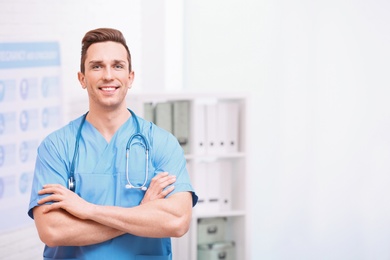 Photo of Portrait of medical assistant with stethoscope in hospital. Space for text