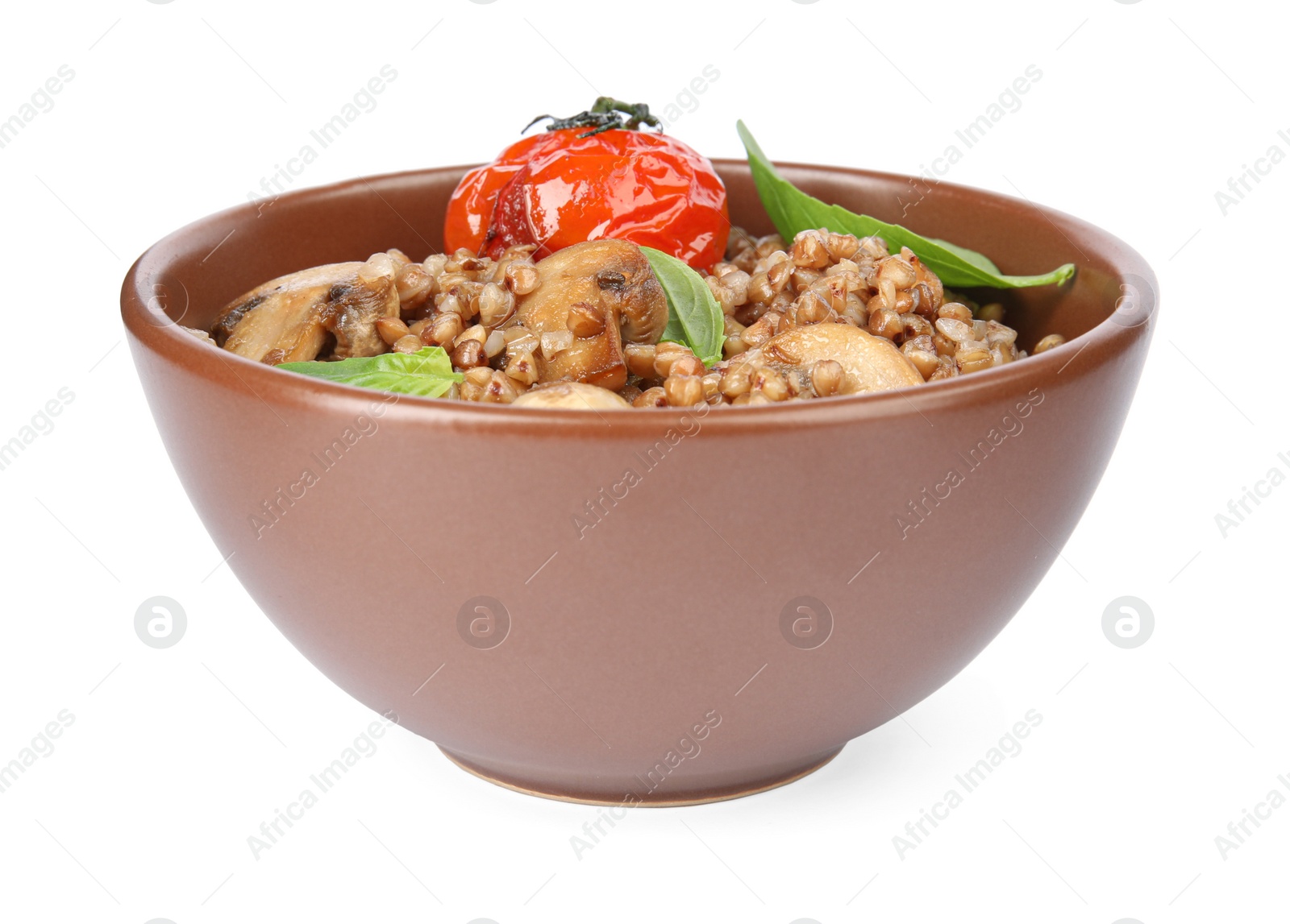 Photo of Delicious buckwheat porridge with mushrooms and tomato on white background