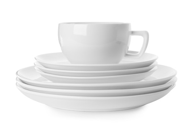 Photo of Set of clean tableware isolated on white