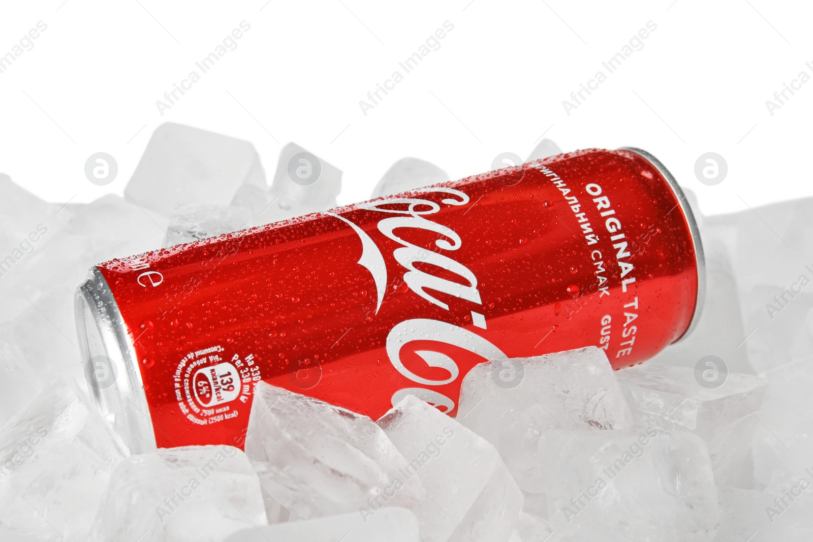 Photo of MYKOLAIV, UKRAINE - NOVEMBER 15, 2018: Coca Cola can on ice cubes against white background