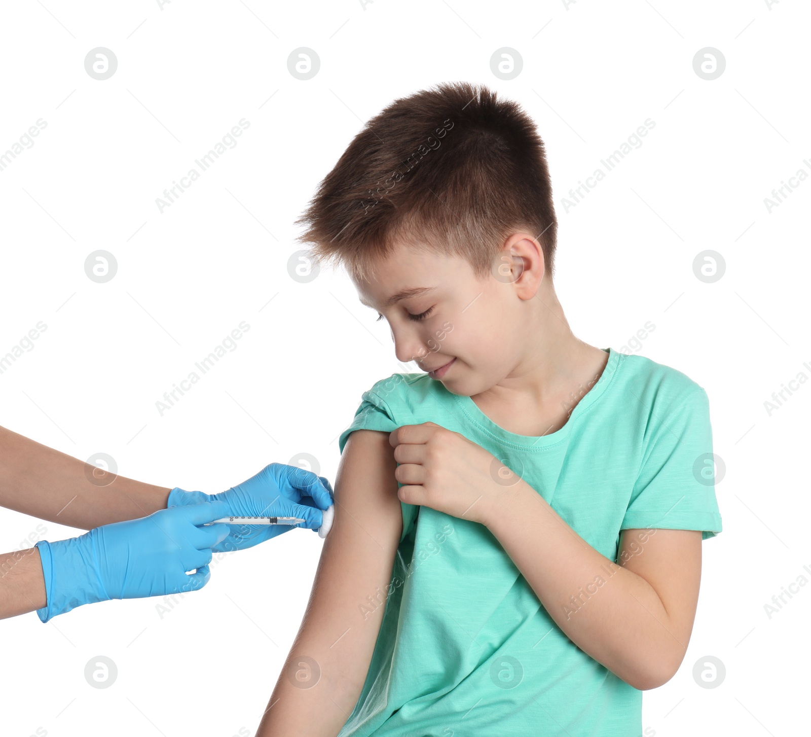 Photo of Doctor vaccinating little child on white background