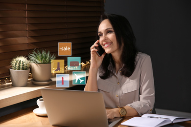 Image of Beautiful woman using laptop at table indoors. Online shopping