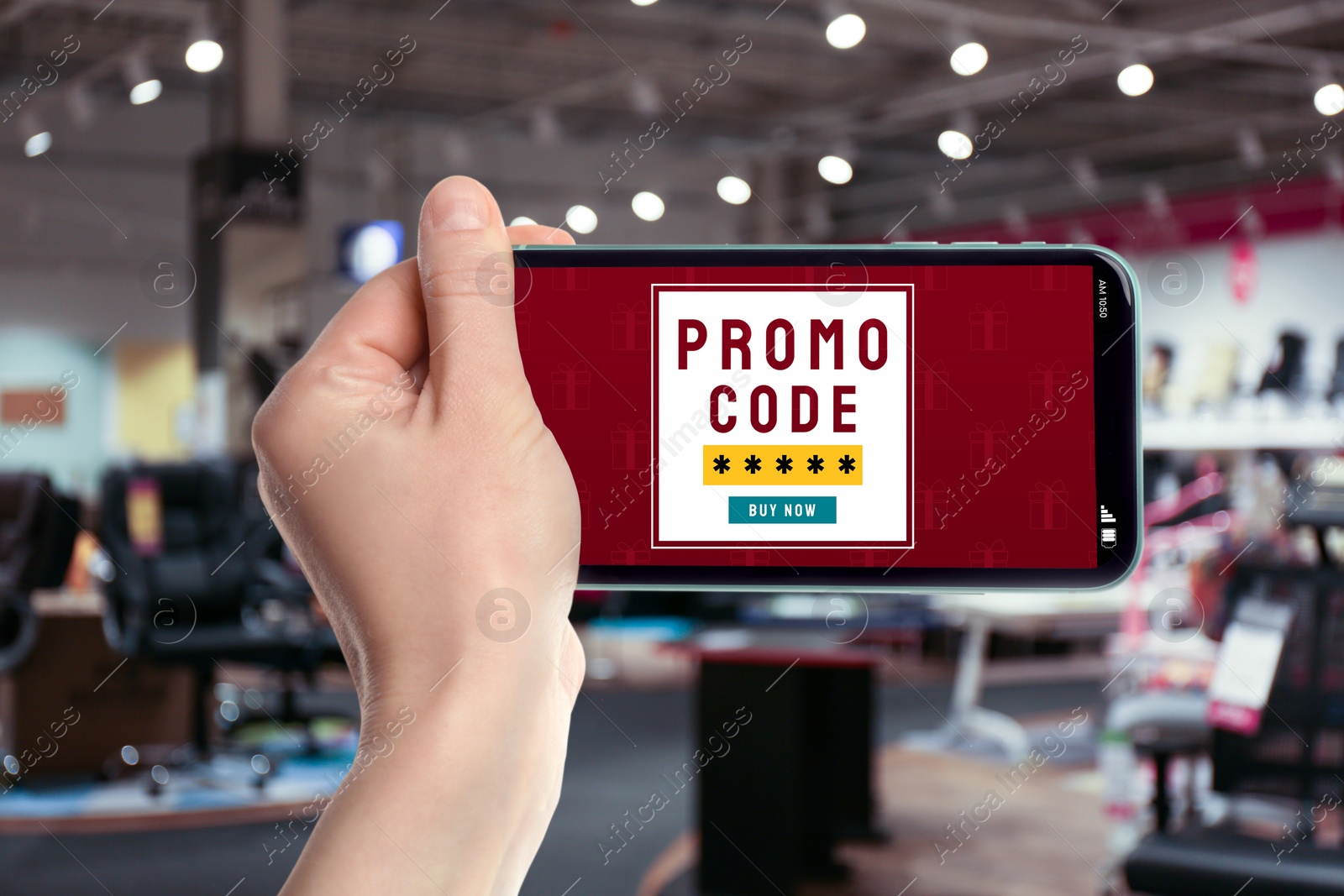 Image of Woman holding smartphone with activated promo code in furniture store, closeup