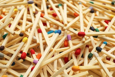 Matches with colorful heads as background, closeup