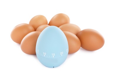 Kitchen timer and chicken eggs on white background
