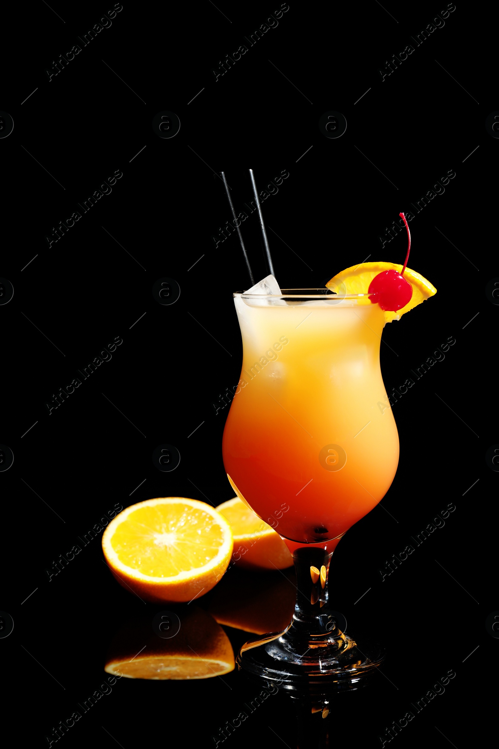 Photo of Just made appetizing cocktail Sex on the Beach, black background