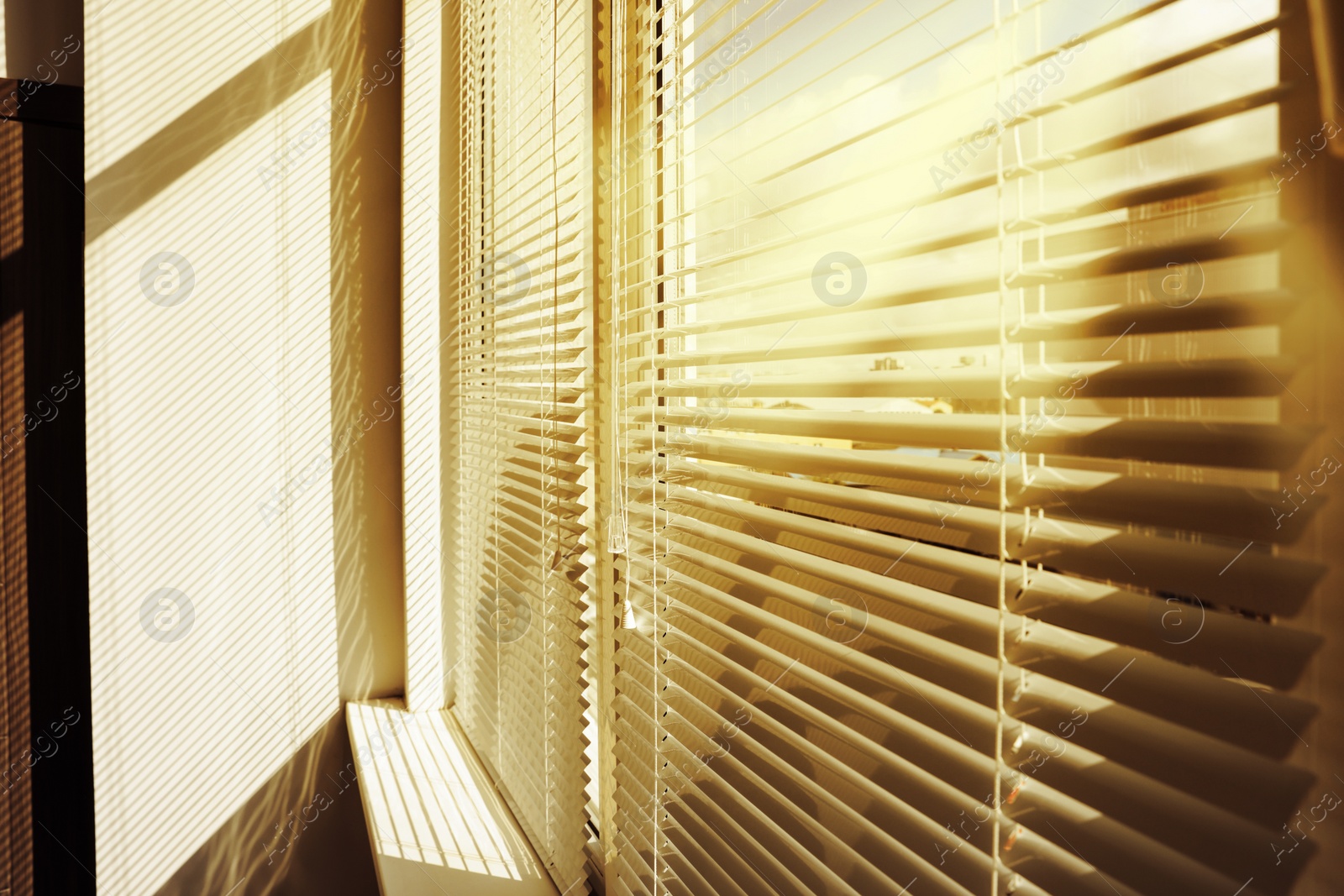 Image of Stylish window with horizontal blinds in room