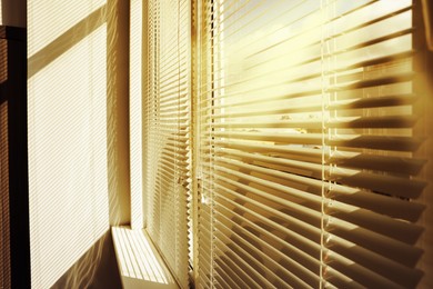 Image of Stylish window with horizontal blinds in room