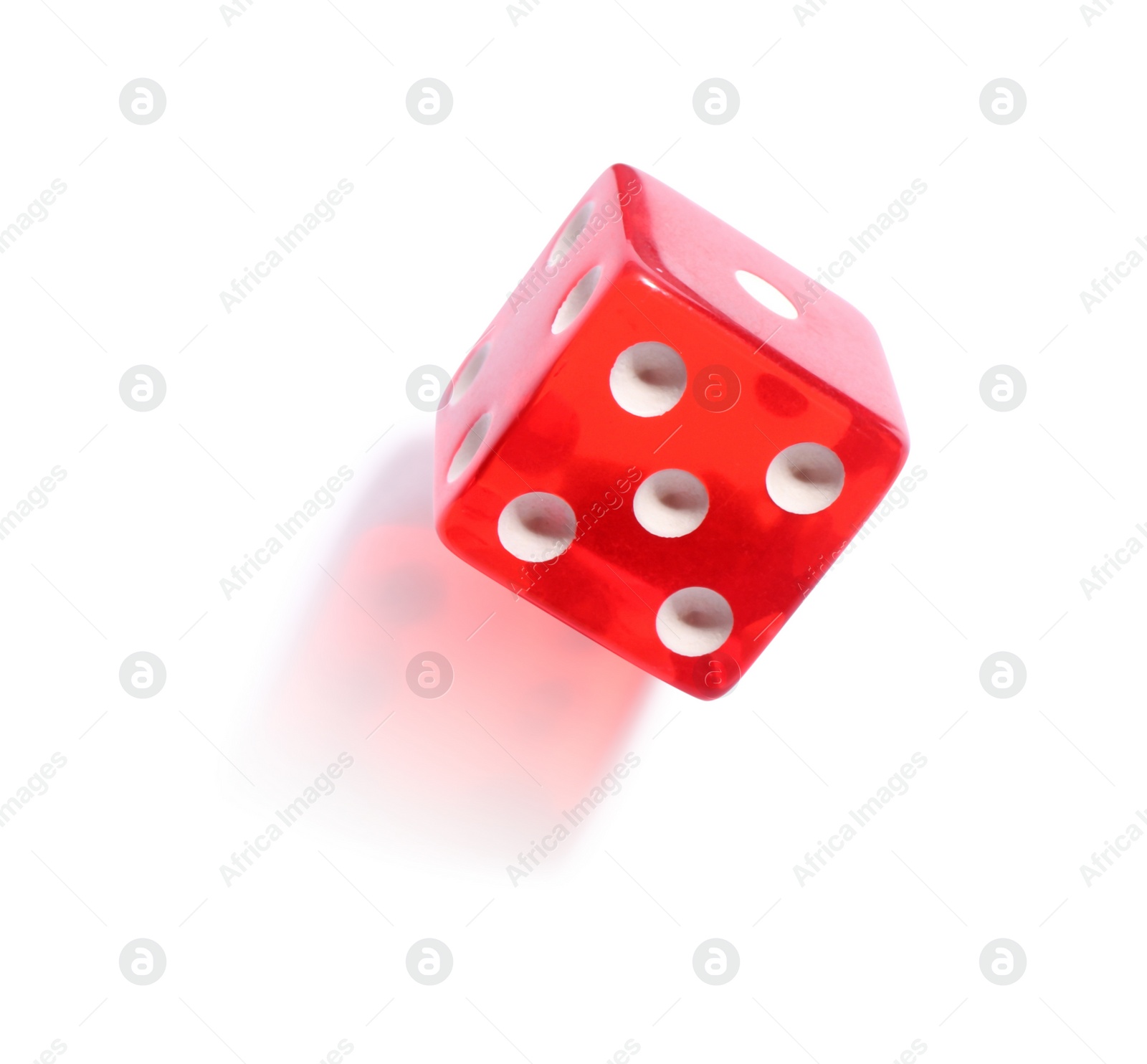 Photo of One red game dice isolated on white