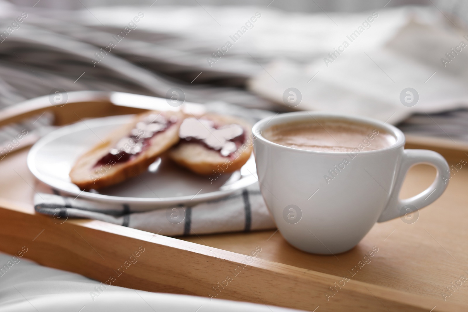 Photo of Morning coffee and sandwiches on tray in bedroom. Space for text