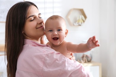 Mother with her cute baby at home