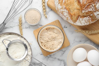 Photo of Flat lay composition with sourdough on white marble table