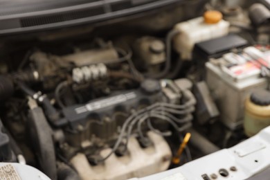 Photo of Blurred view of engine bay in modern car