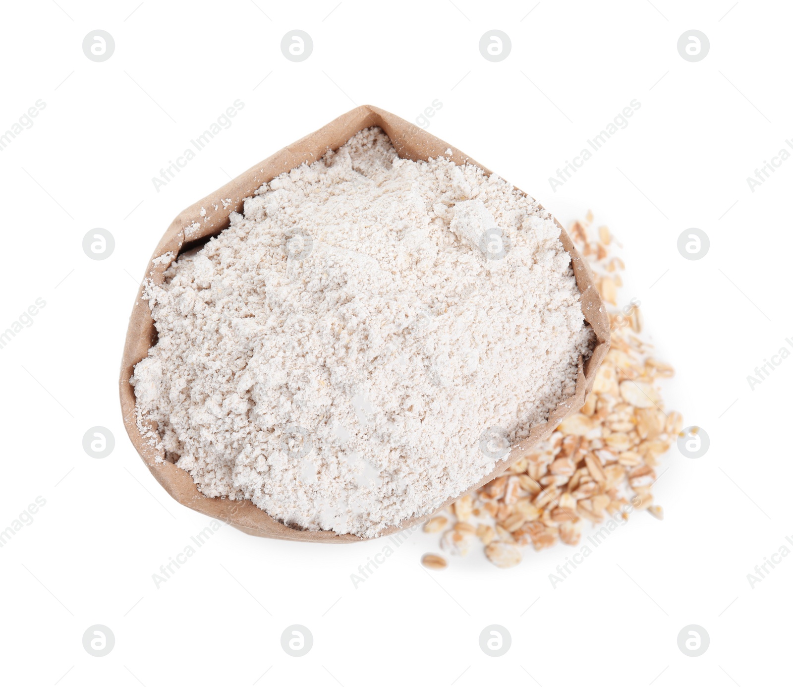 Photo of Paper bag with oatmeal flour and flakes isolated on white, top view