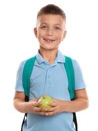 Photo of Happy boy holding apple on white background. Healthy food for school lunch