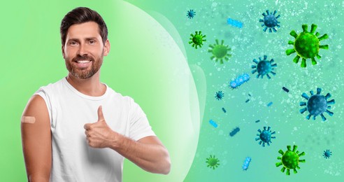 Man with strong immunity due to vaccination surrounded by viruses on green background, banner design