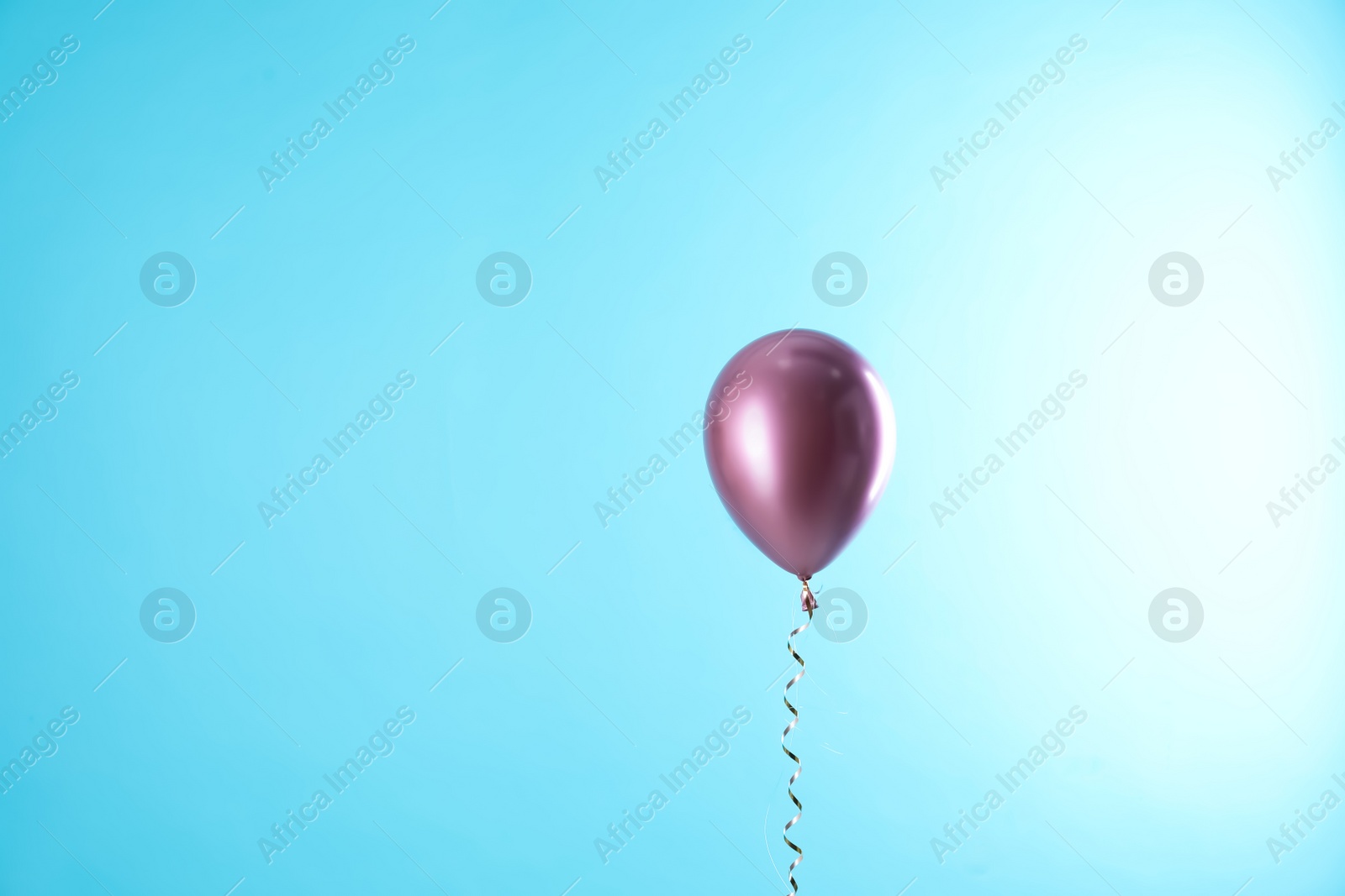 Photo of Bright balloon on color background. Space for text