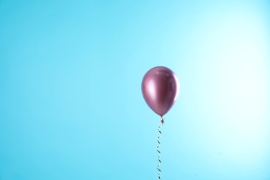 Photo of Bright balloon on color background. Space for text