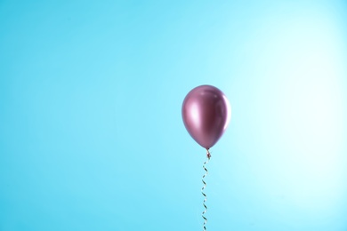 Bright balloon on color background. Space for text