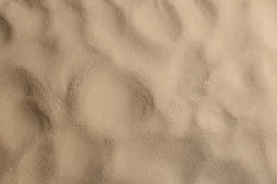 Photo of Dry beach sand as background, top view