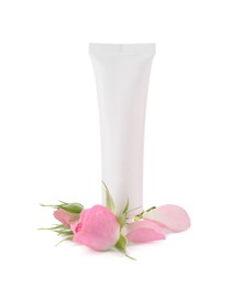 Photo of Tube of hand cream and roses on white background