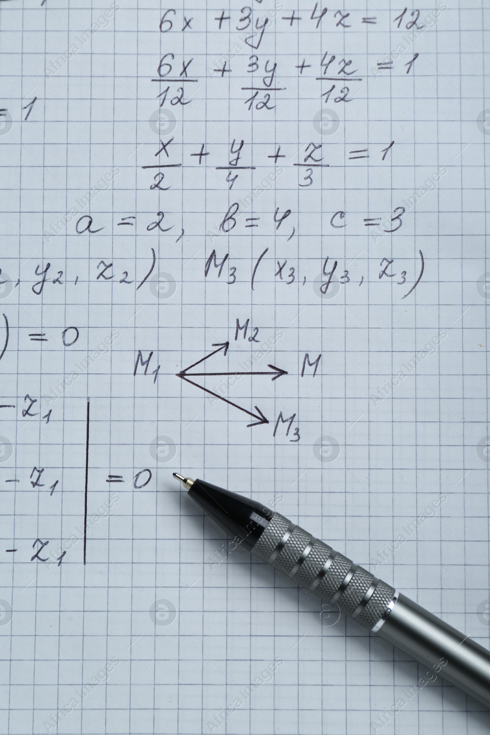 Photo of Sheet of paper with different mathematical formulas and pen, top view