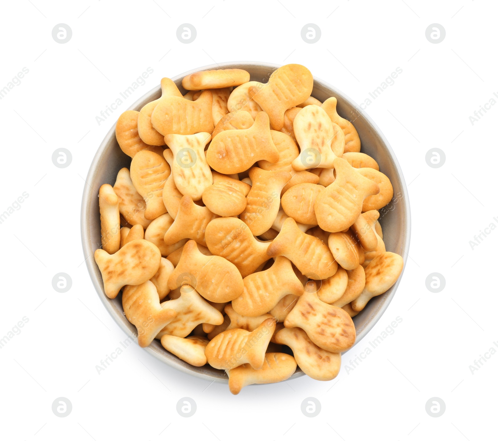 Photo of Delicious goldfish crackers in bowl isolated on white