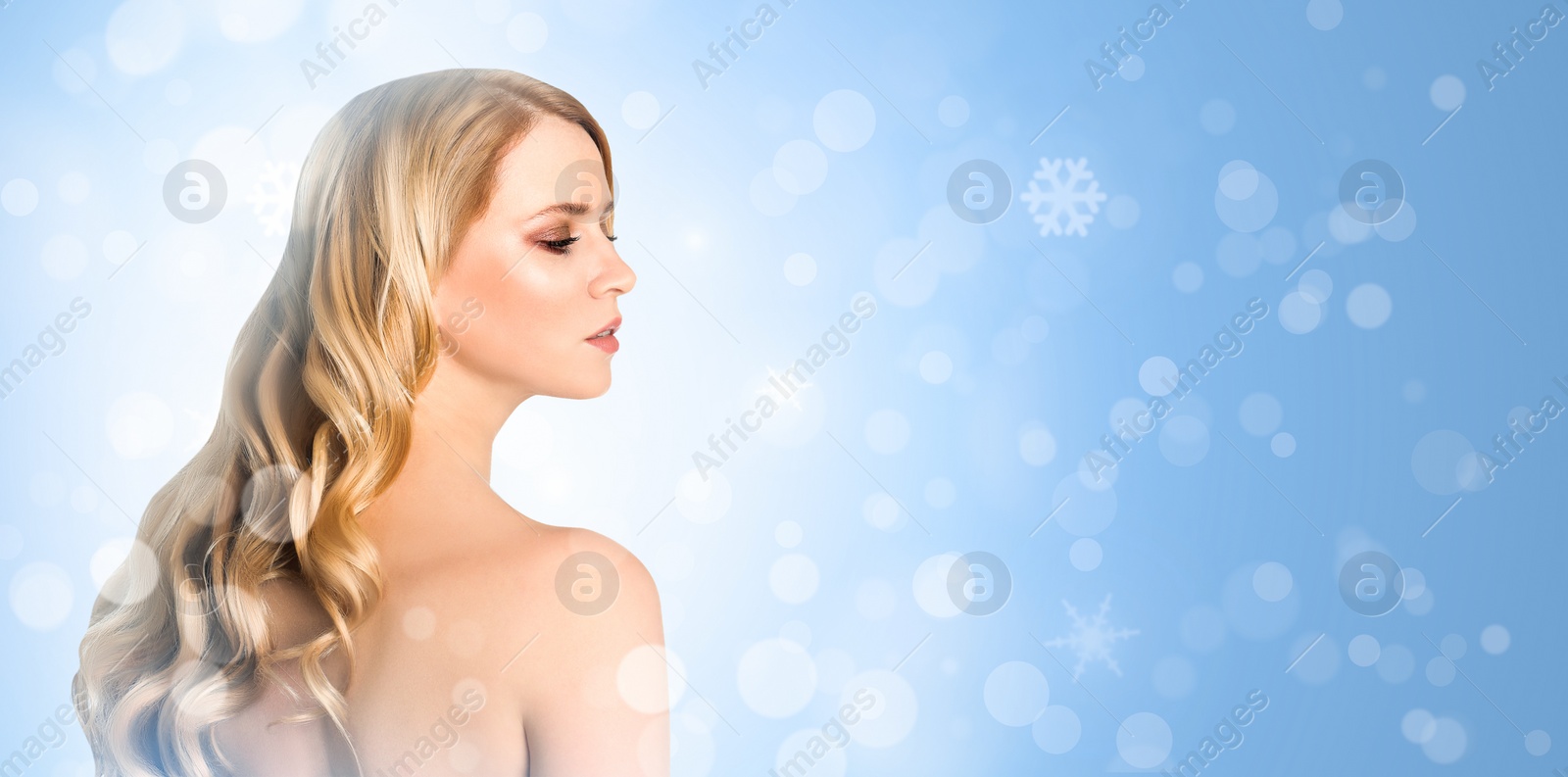 Image of Young woman with perfect smooth skin on light blue background, bokeh effect. Space for text