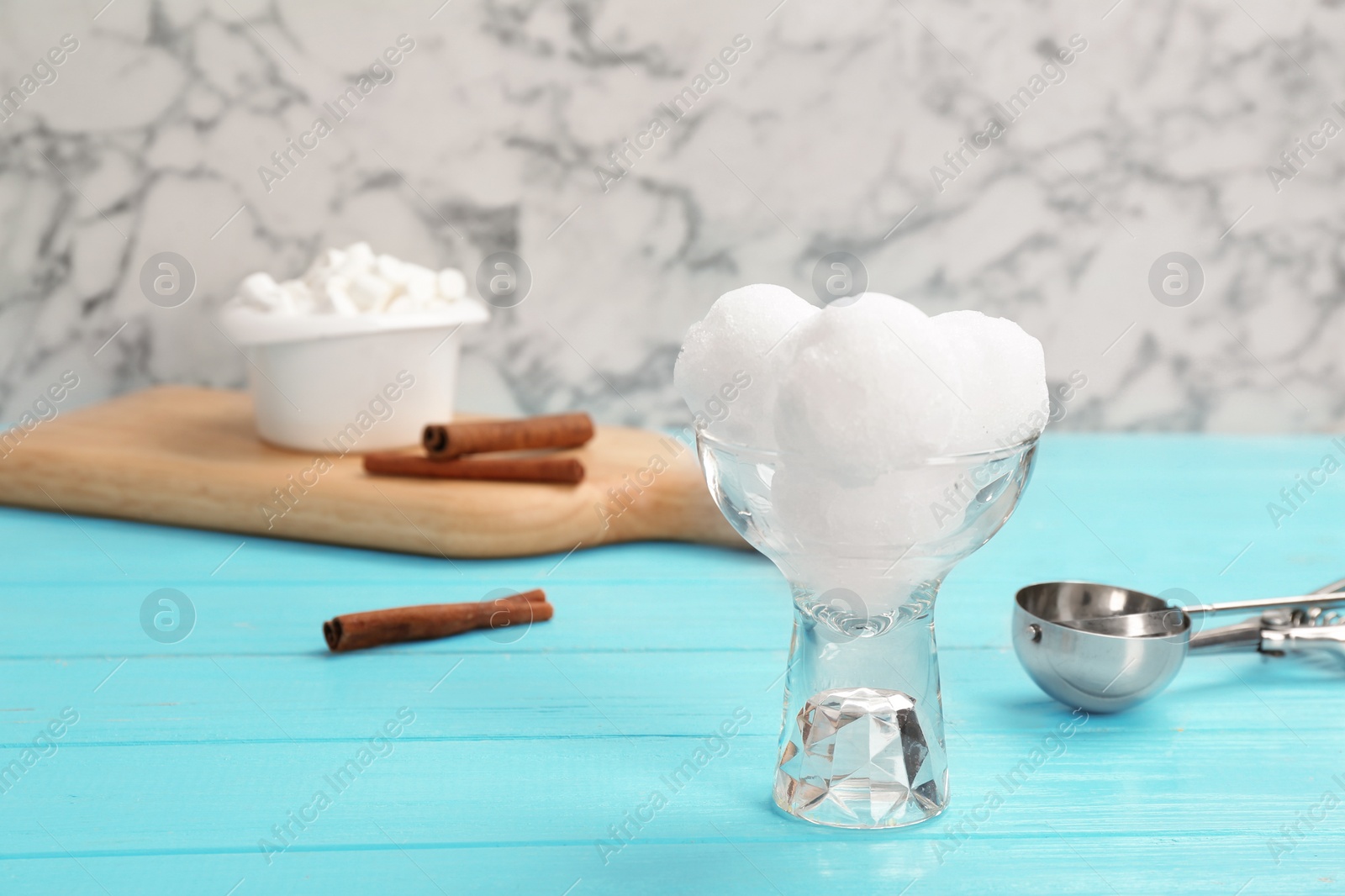 Photo of Bowl of tasty snow ice cream balls on table against marble background. Space for text