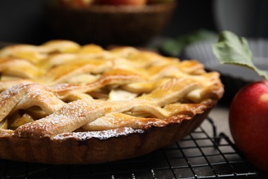 Photo of Delicious traditional apple pie on table, closeup