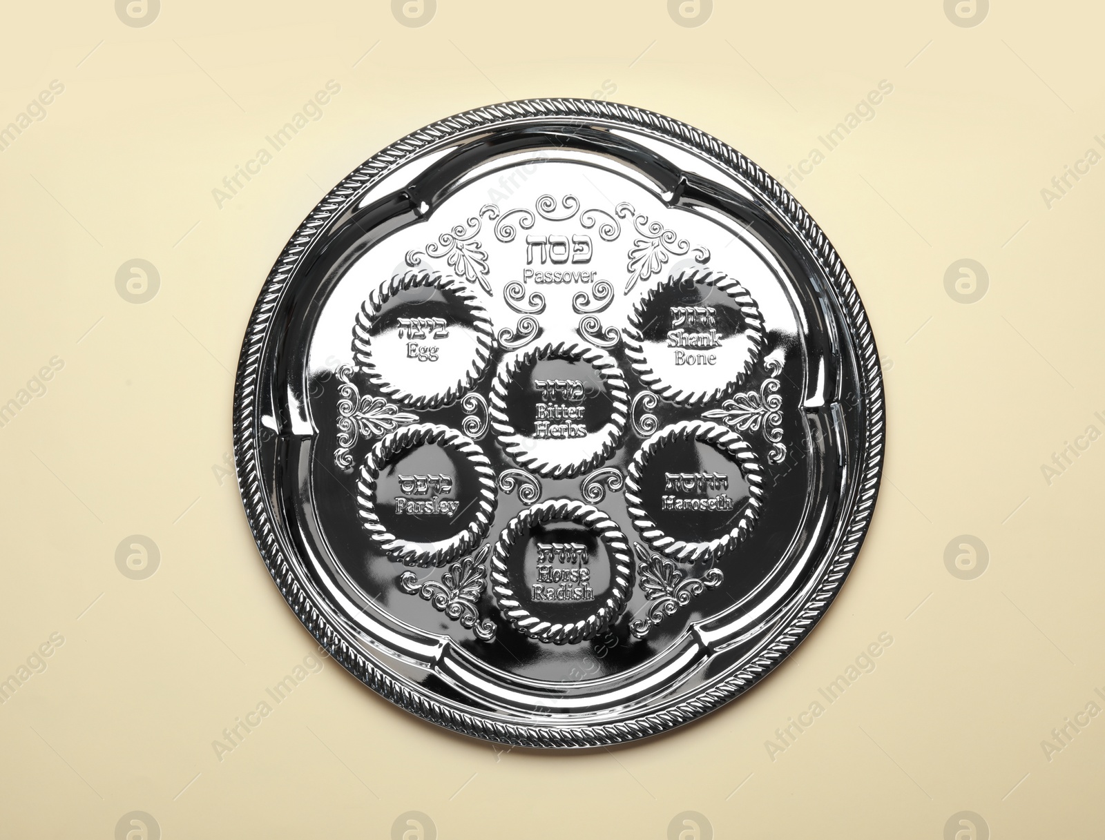 Photo of Empty traditional Passover (Pesach) Seder plate on color background, top view