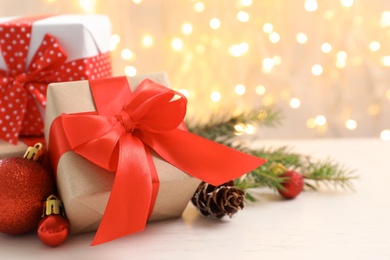 Christmas gifts and decoration on table against blurred background